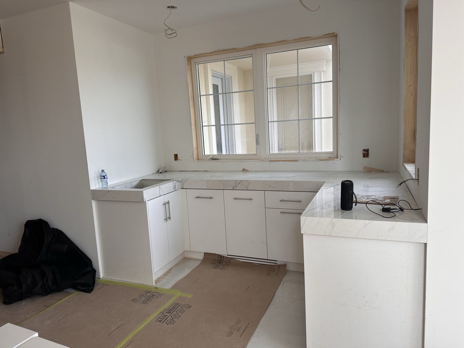 Kitchen cabinetry and stone counters at the Fenton Way residence, Brampton