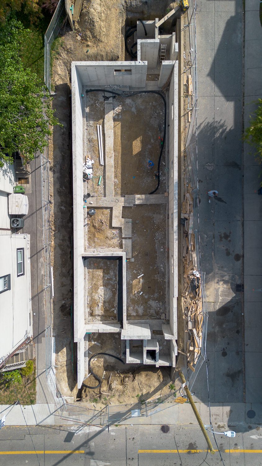 Aerial view straight down onto the poured foundation of a new custom home on Knox Avenue, Leslieville