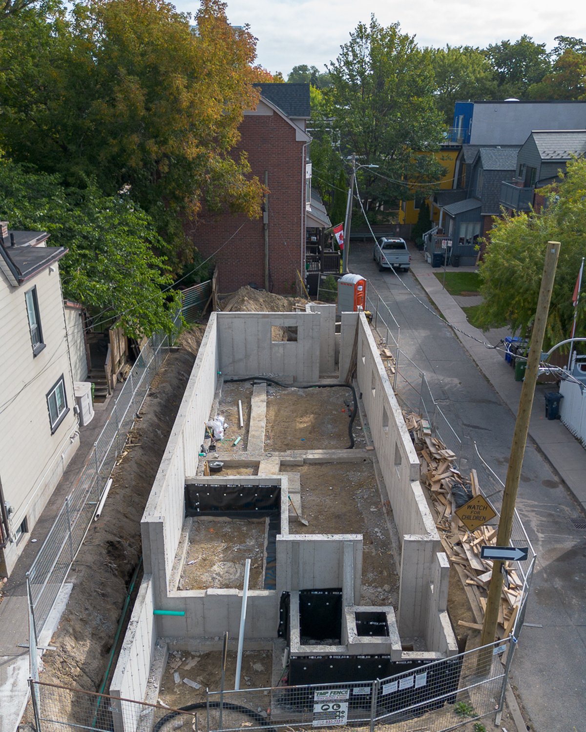 Aerial view of the formed and poured concrete foundation at 87 Knox Avenue, Leslieville, on its narrow lot