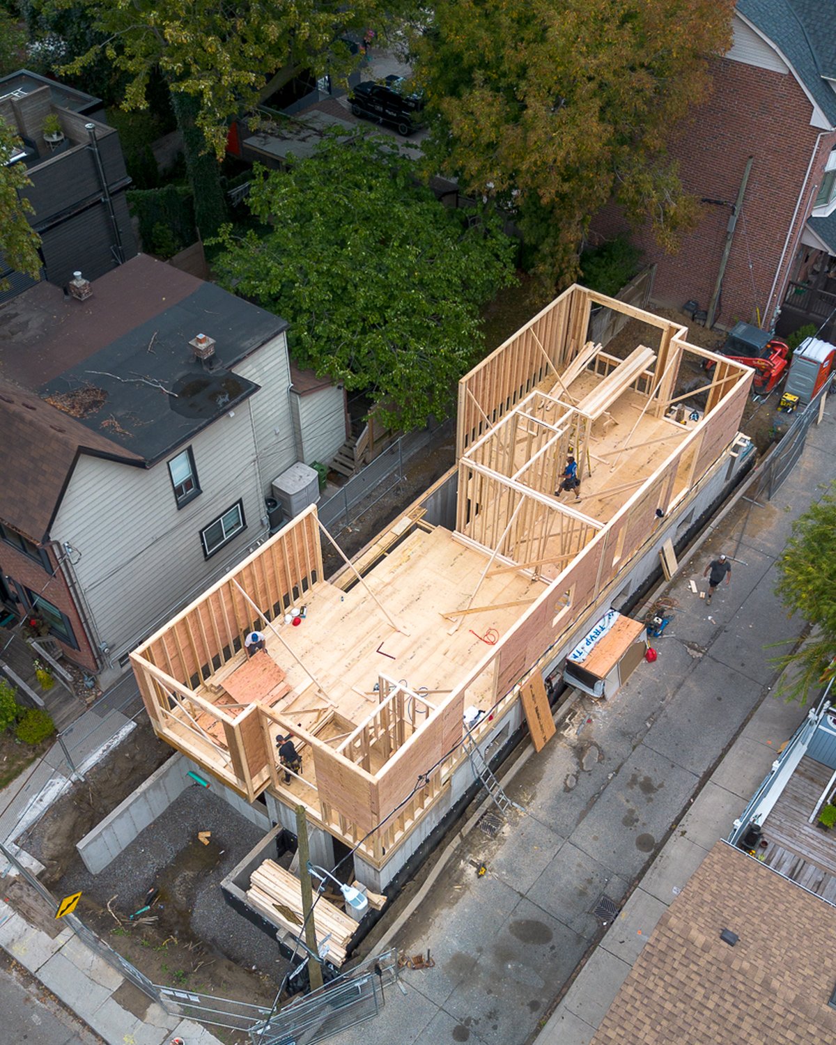 Aerial view of framing rising on the foundation at 87 Knox Avenue, Leslieville